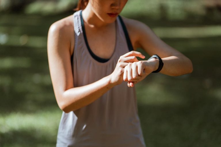 woman looking at her smartwatch